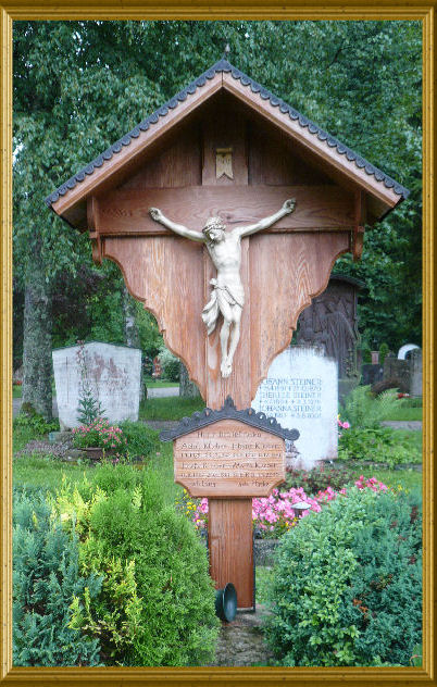 Grave cross made of larch wood with Christ