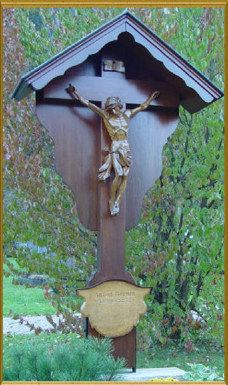 Simple wooden grave cross with Body of Christ